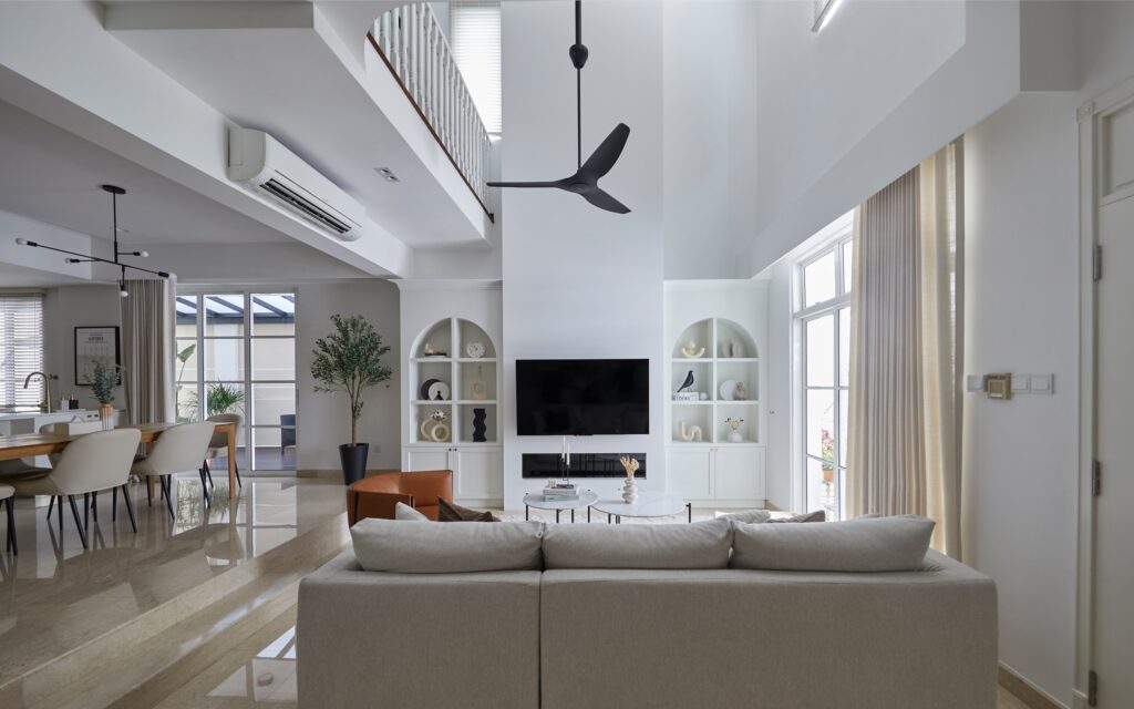Modern luxury interiors featuring a double-height living room with large windows